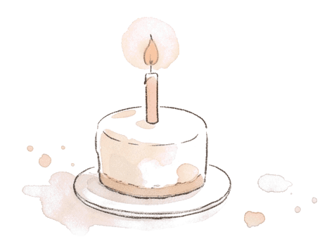 A small birthday cake with one candle